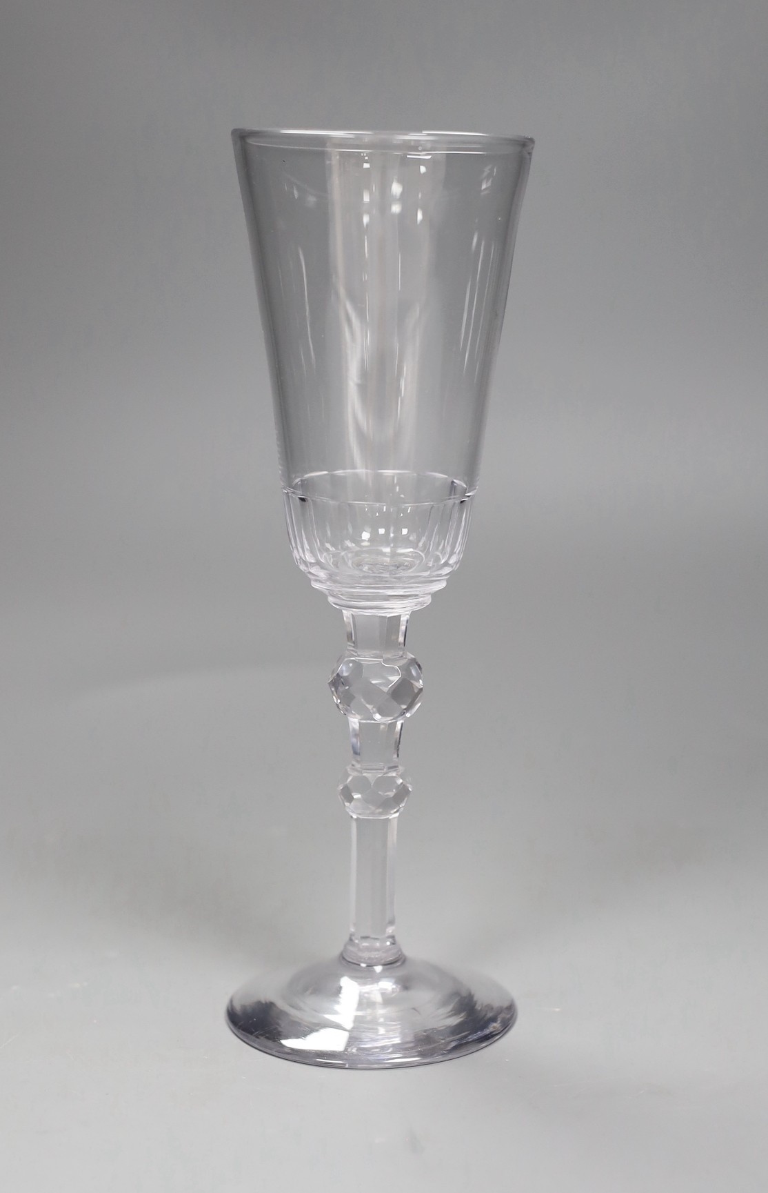 An 18th century facet stemmed ale glass, 22.5cms high